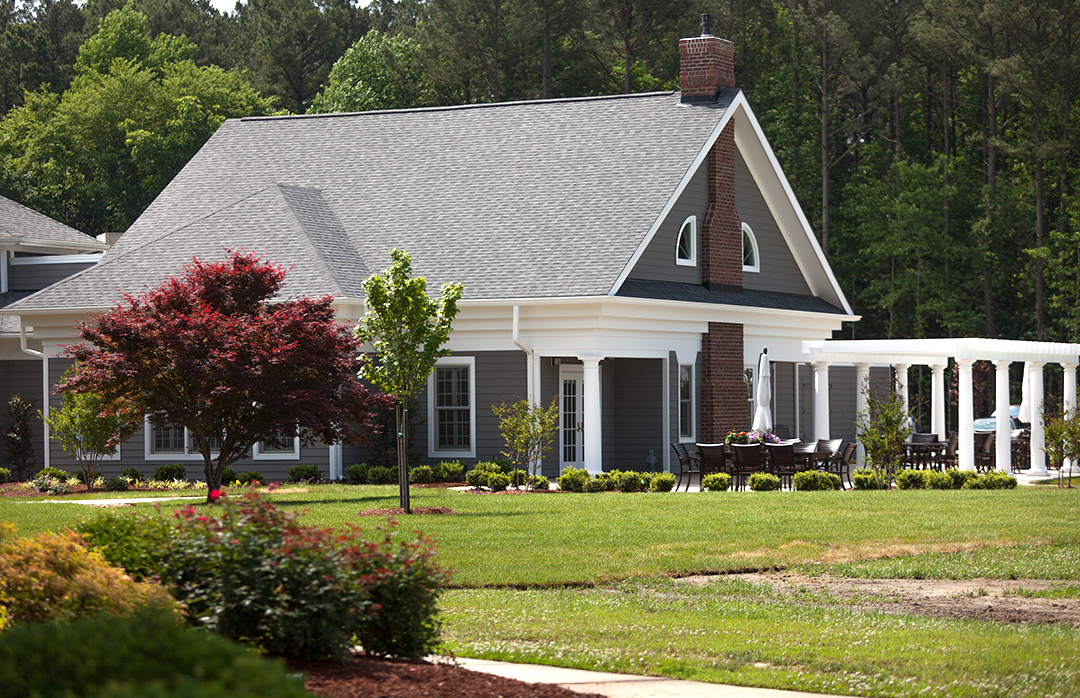 Exterior view of a senior living facility with landscaping