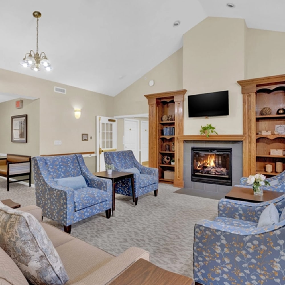 Cozy common area with seating and a fireplace