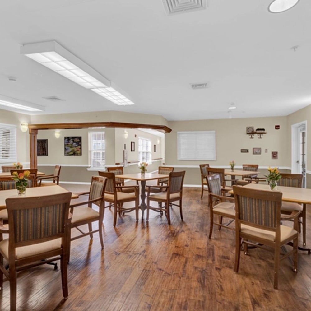 Dining area with wooden tables and chairs