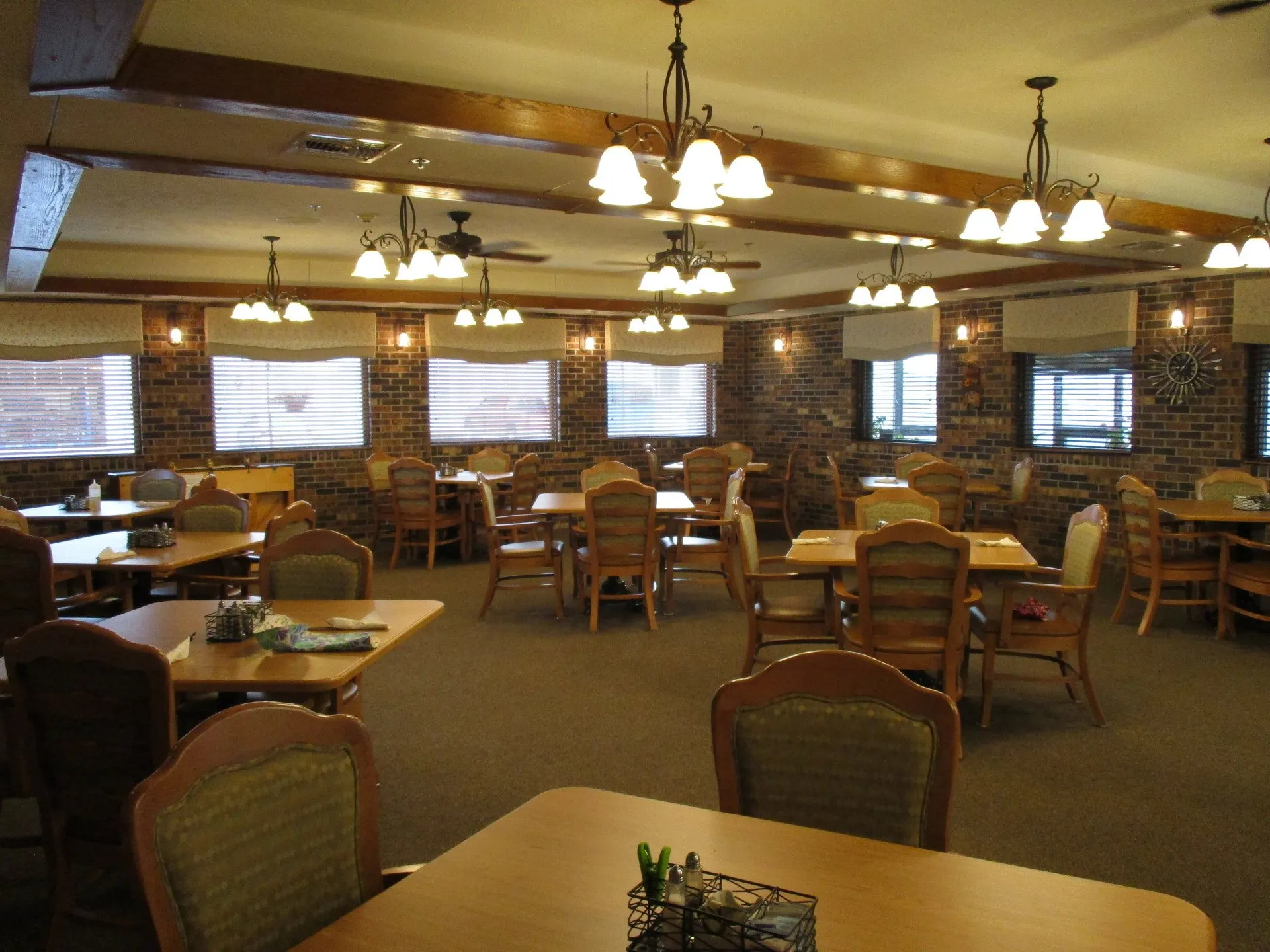 Dining room with wooden tables and warm lighting