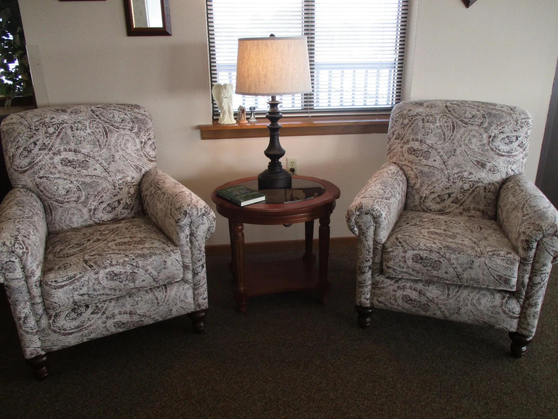 Cozy seating area with two armchairs and a lamp