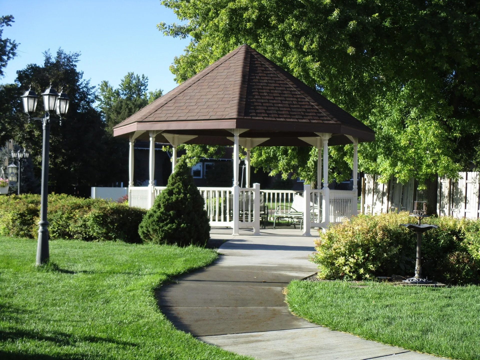 A gazebo in a well-maintained garden