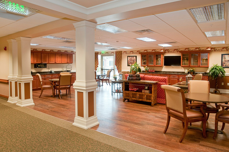 Bright common area with a dining setup and kitchen