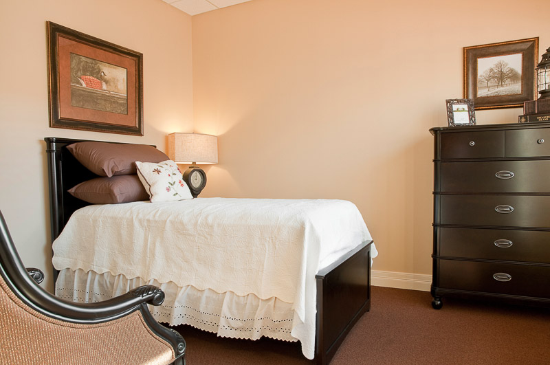 Well-furnished bedroom in a senior living facility