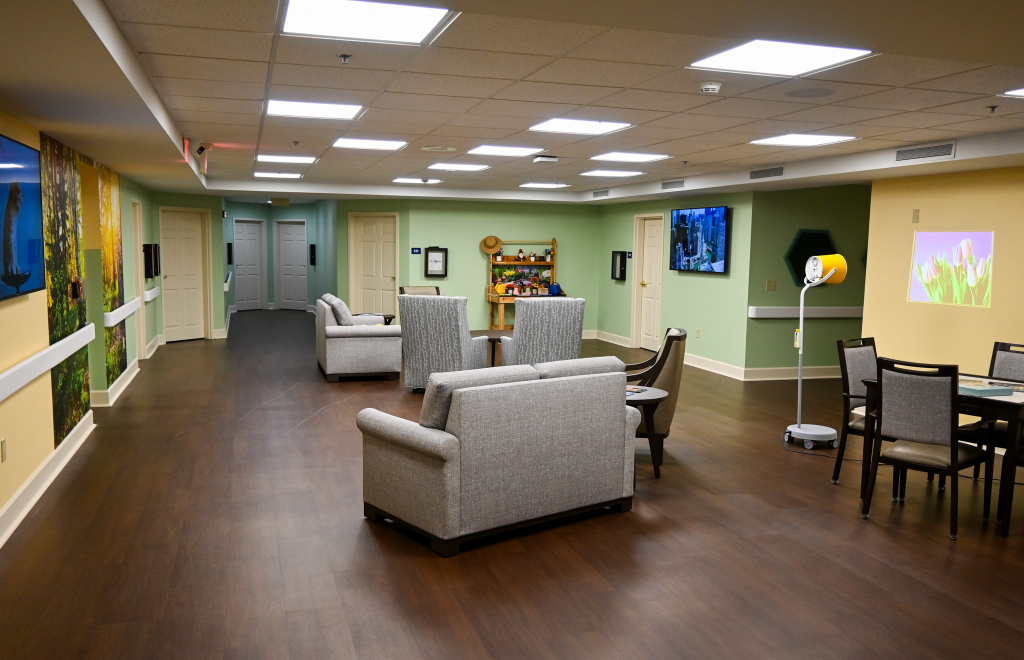 Common area with seating and decor in a nursing home