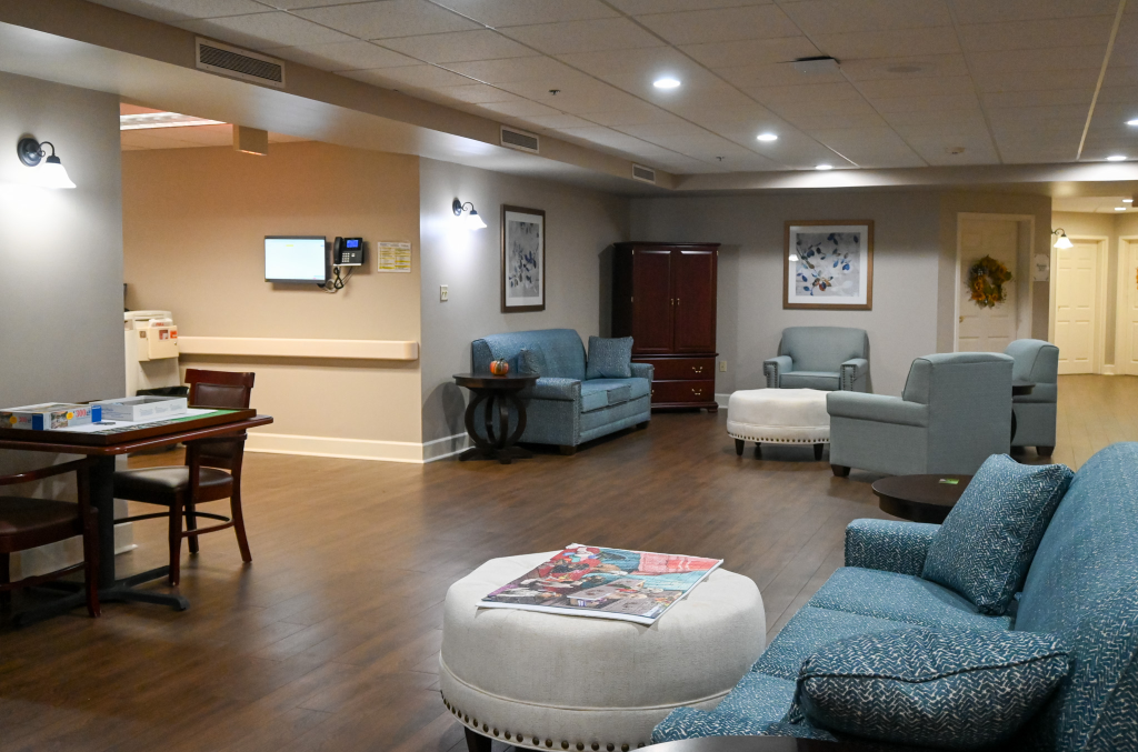 Common area with seating and tables in a nursing home