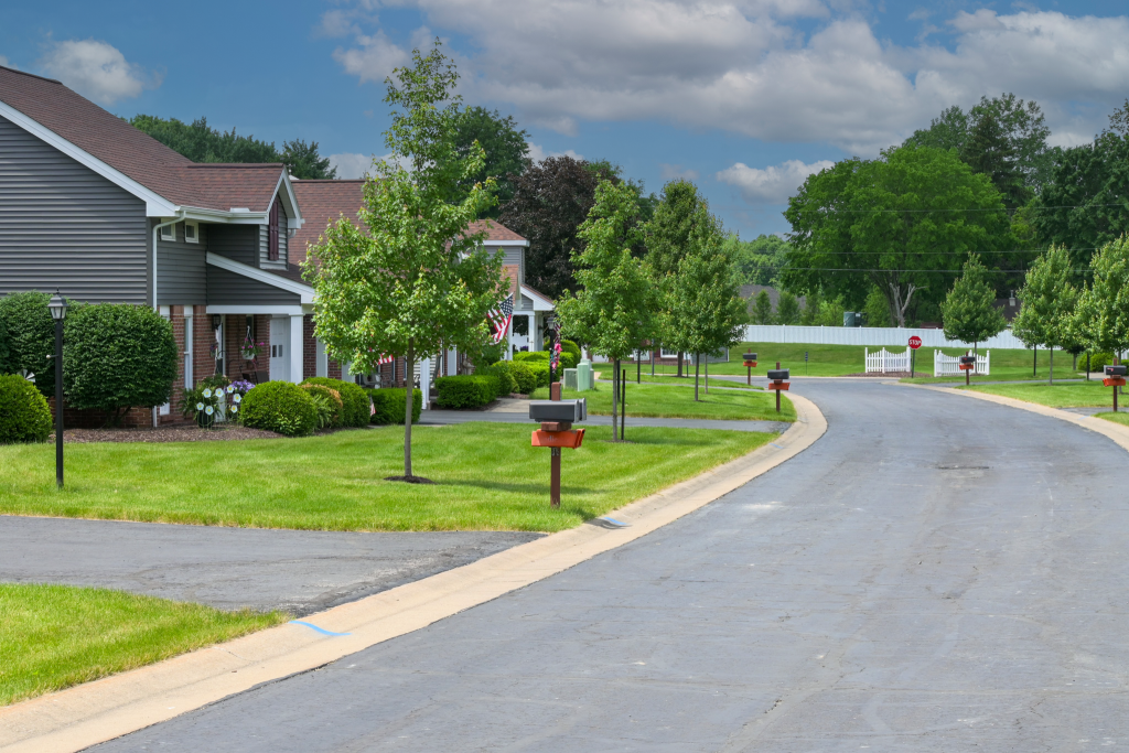 A serene residential street with houses and green lawns