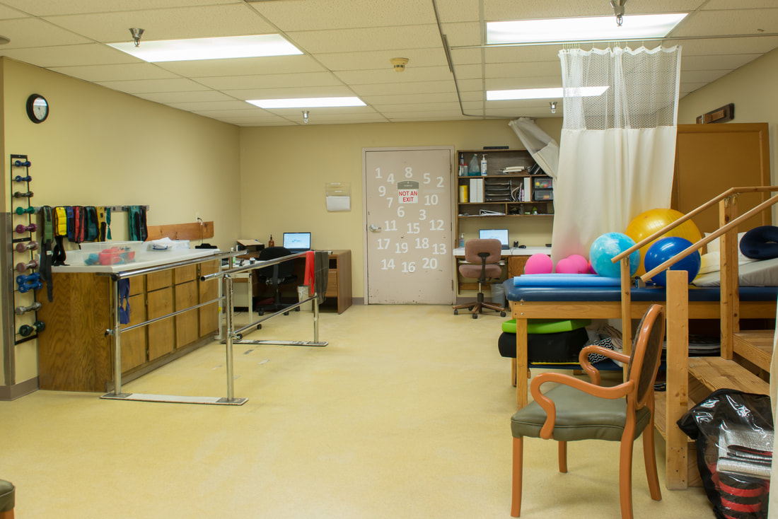 Interior rehabilitation room with equipment and exercise tools