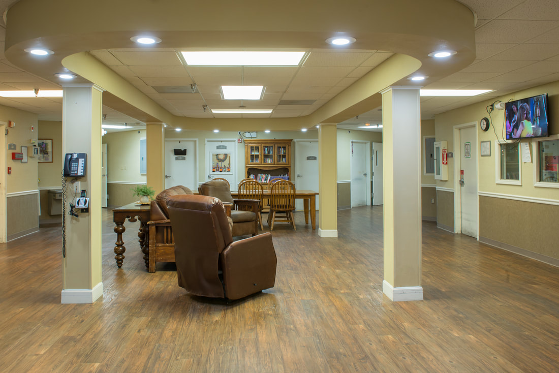Bright interior common area with seating and tables