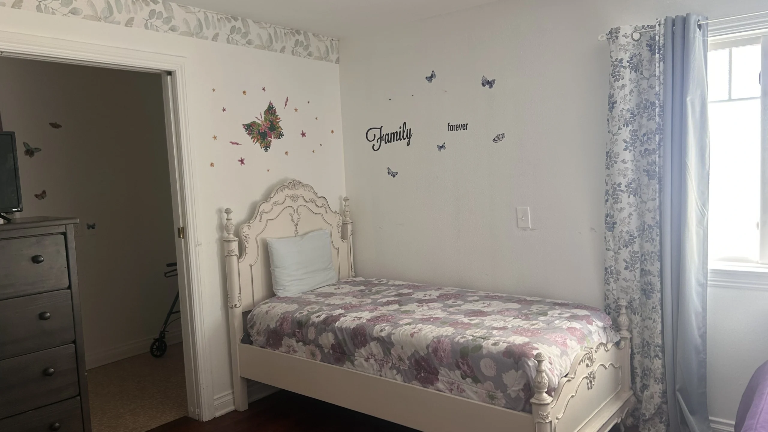 Cozy bedroom setup with butterfly decor