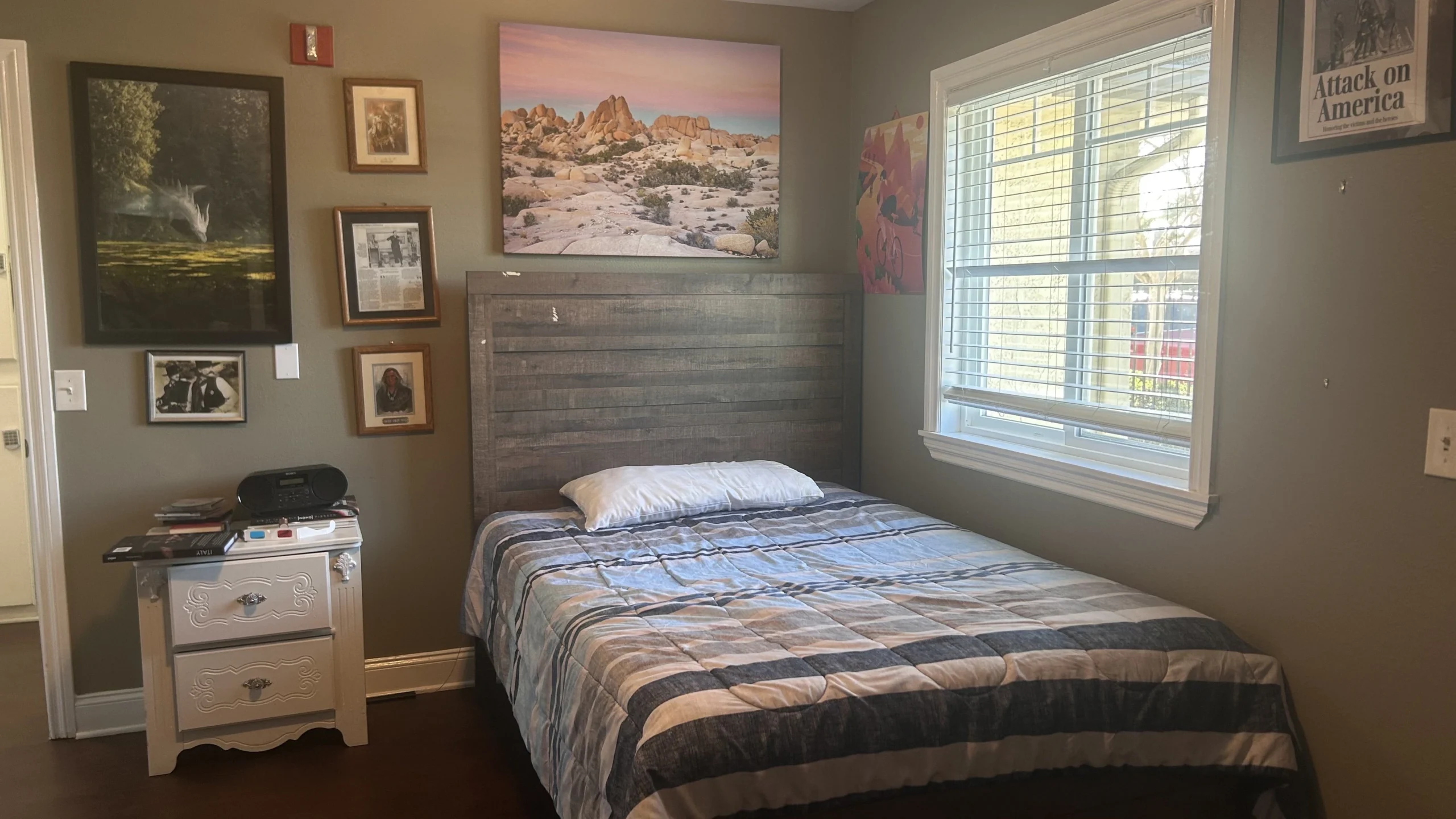 Cozy private room with a bed and wall decor