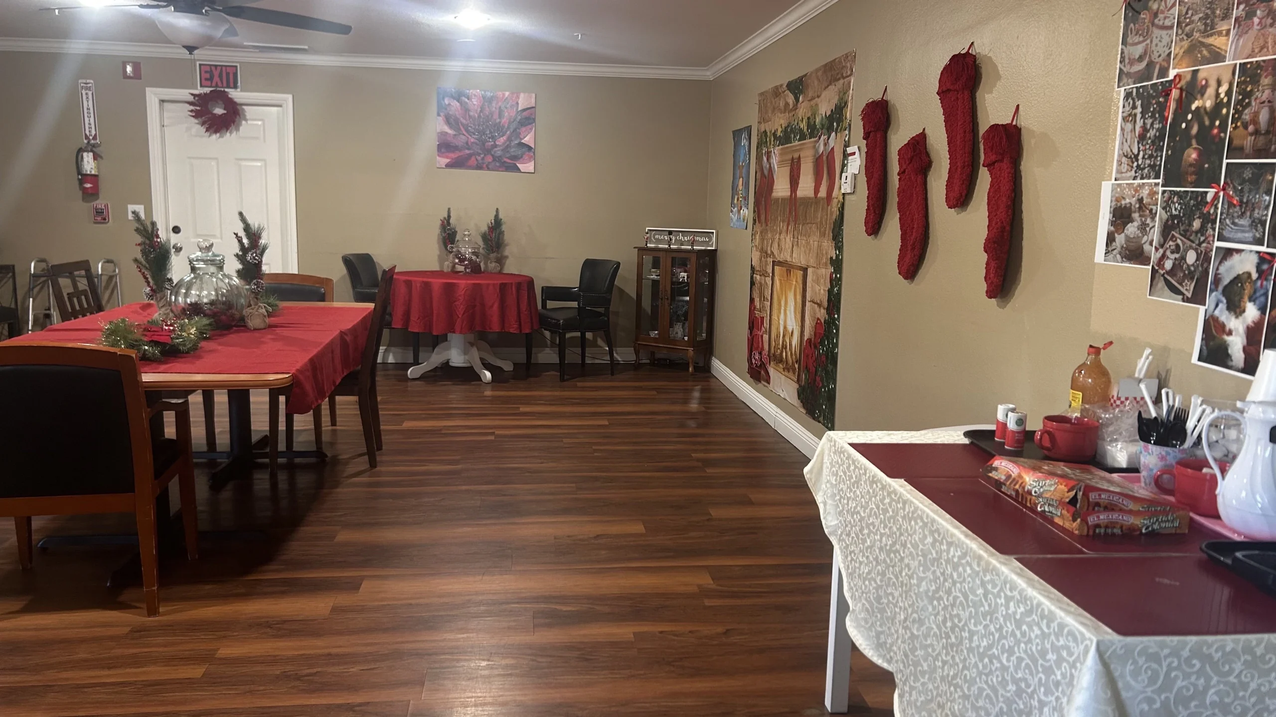 Interior view of a decorated common area with tables and festive decor