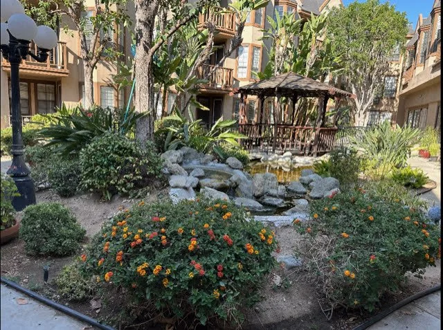 Beautiful outdoor garden area with gazebo and colorful flowers