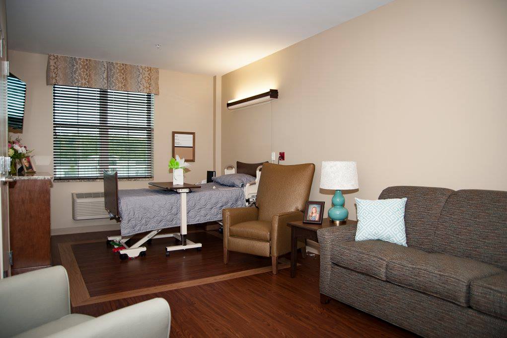 Cozy resident room with bed and seating area