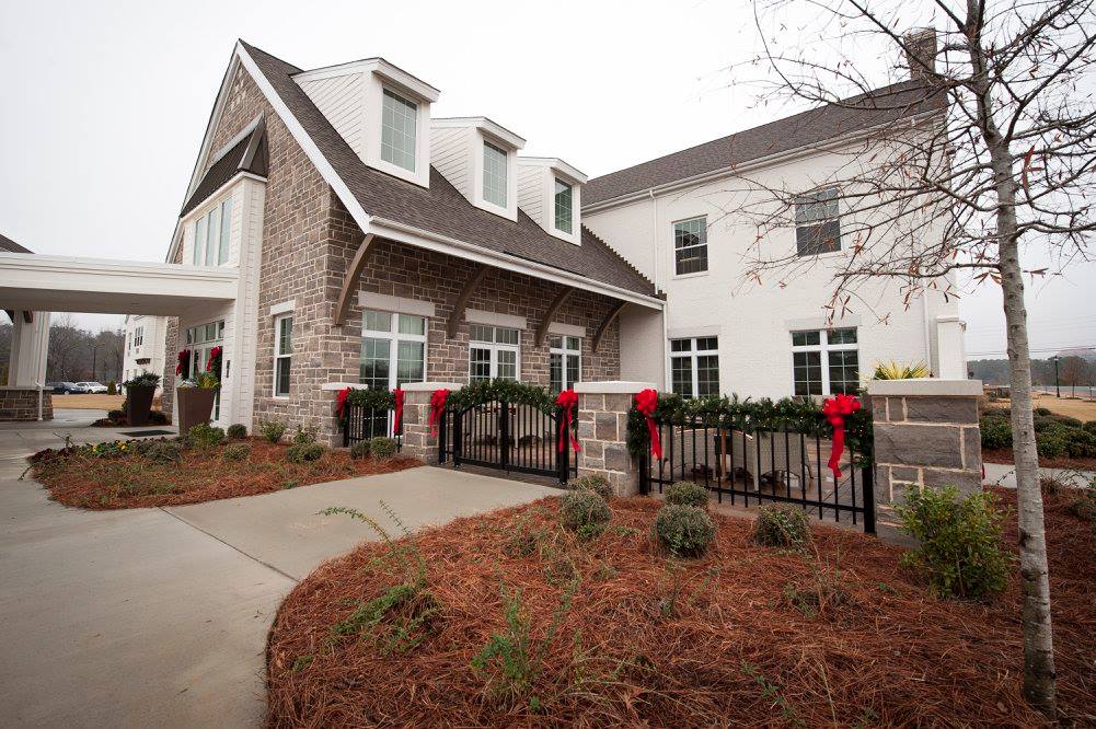 Exterior view of assisted living facility with holiday decorations