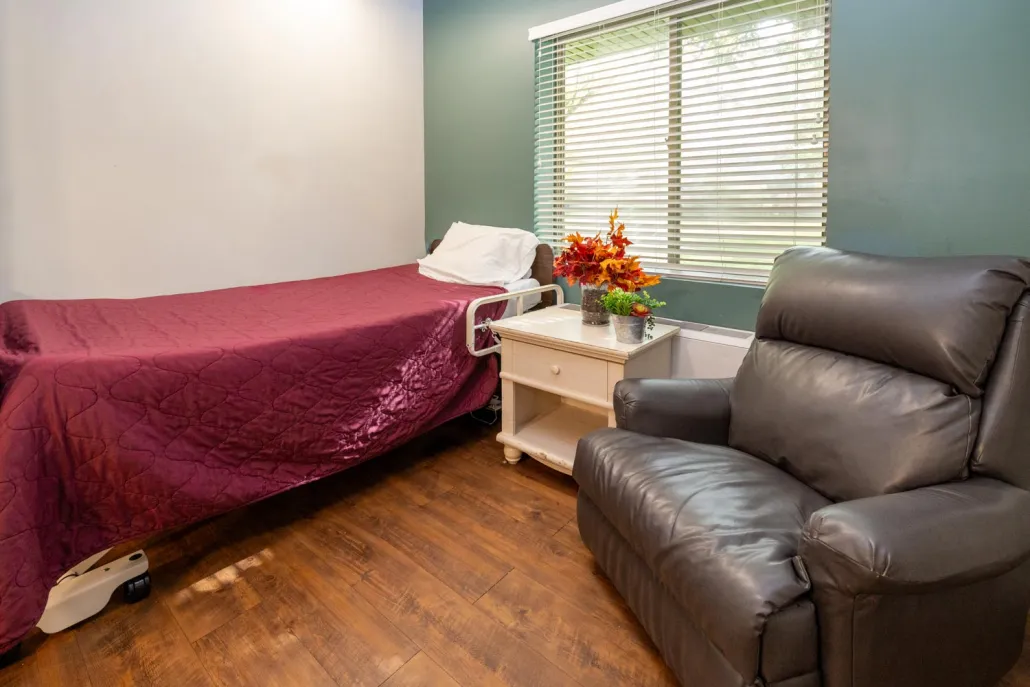 Cozy resident room with bed and chair