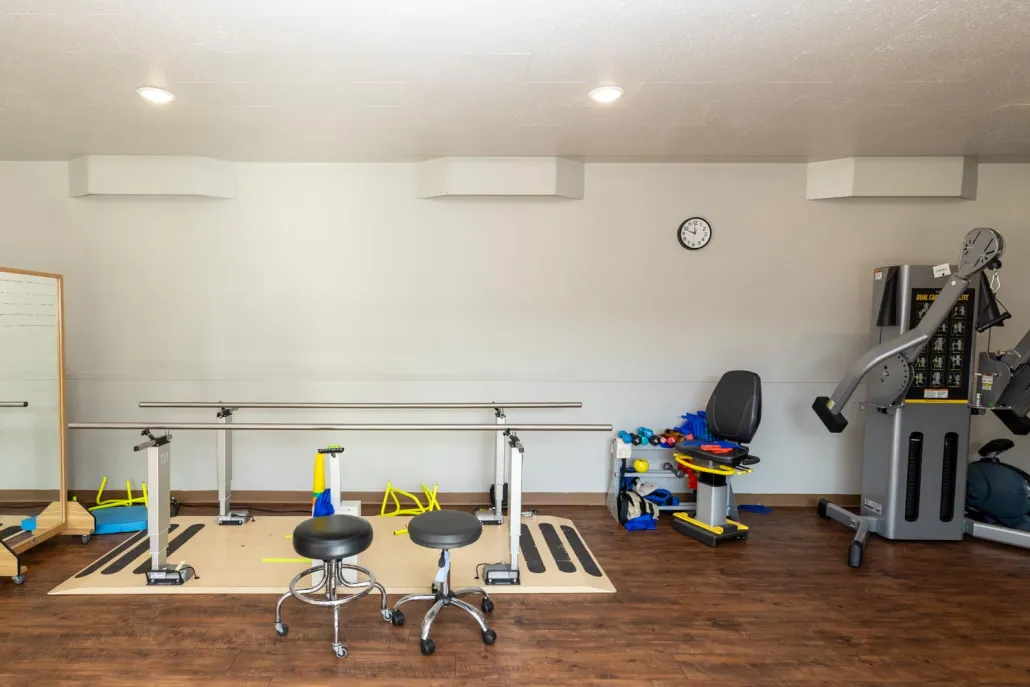 Rehabilitation gym with equipment for therapy.