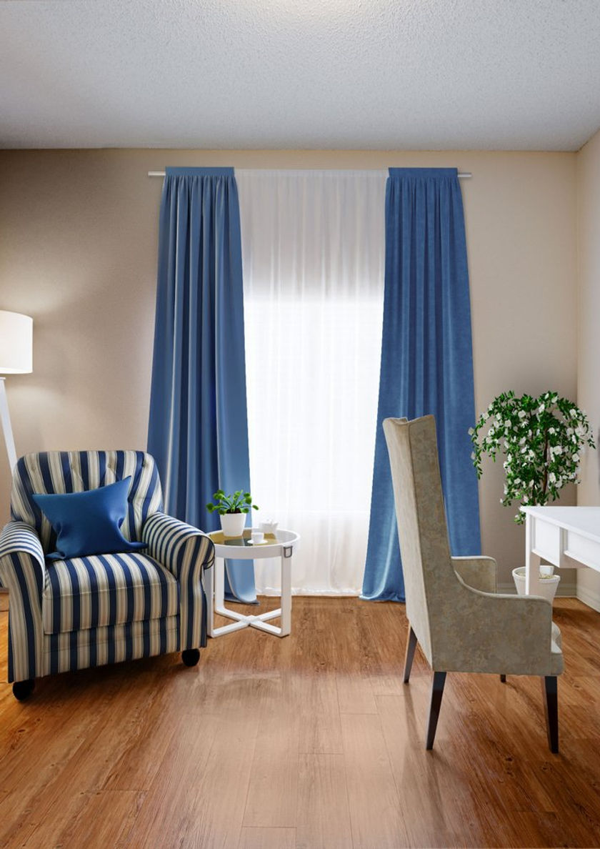 Cozy interior sitting area with blue curtains