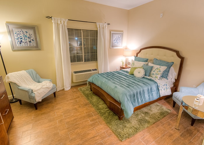 Comfortable resident room with soft blue decor