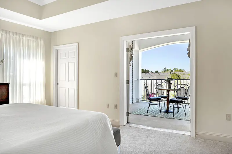 Bright interior room leading to a balcony