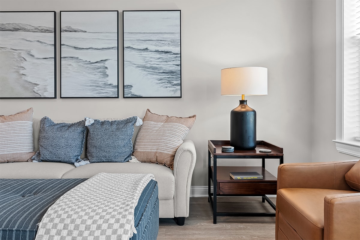 Cozy living room with coastal artwork and modern decor