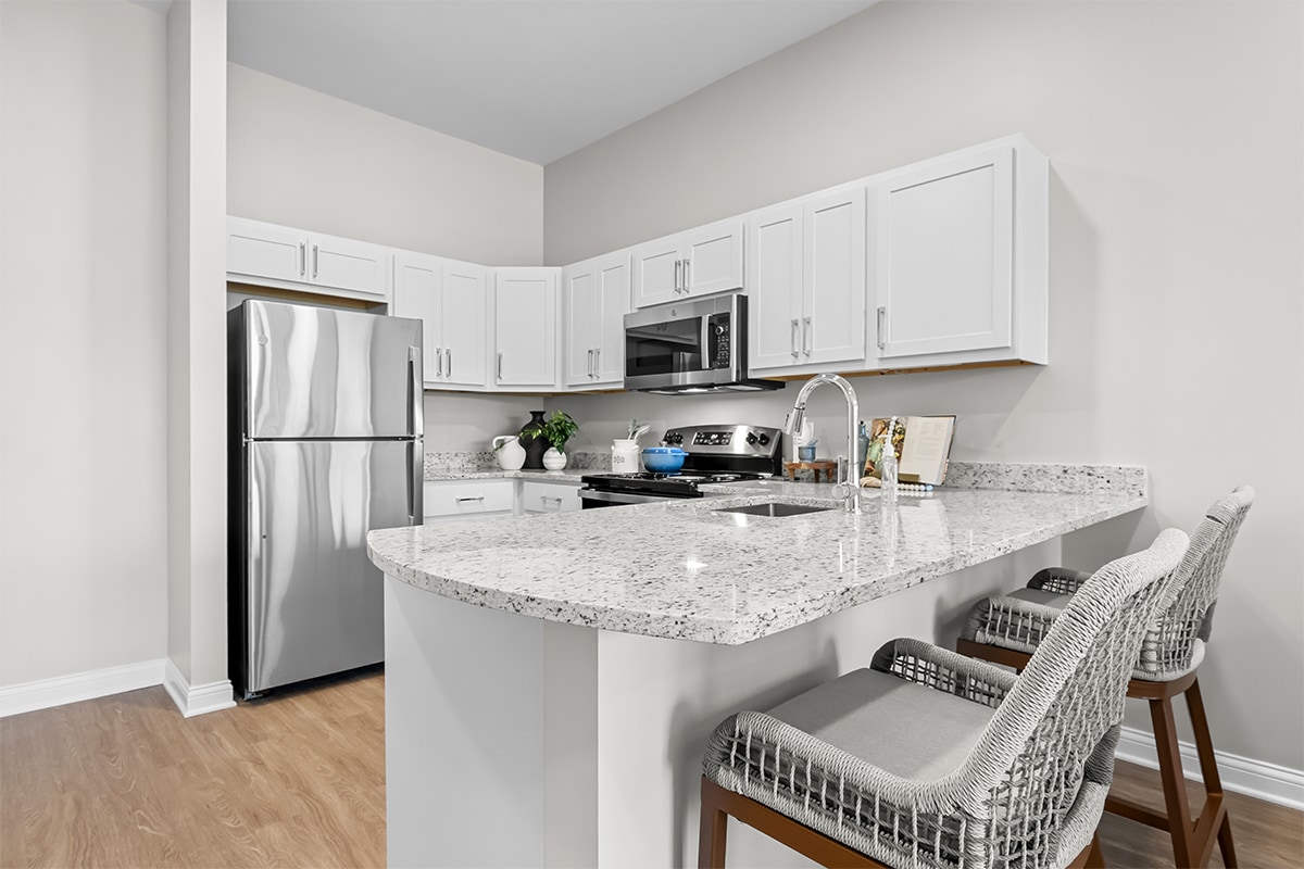 Modern kitchen interior with appliances and seating