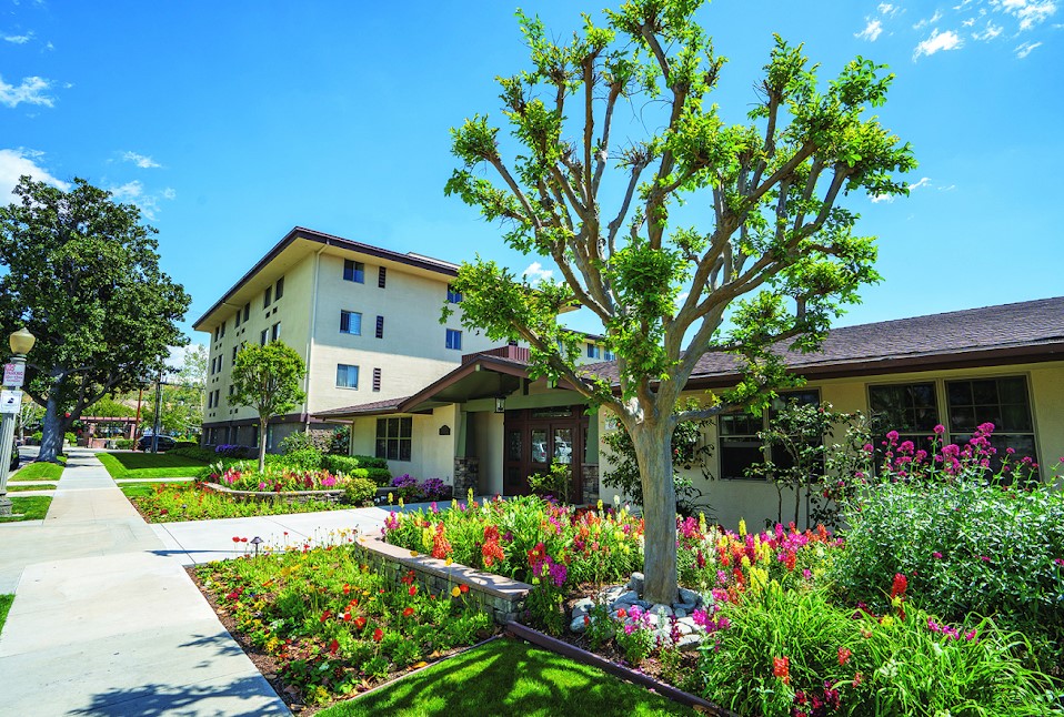 Exterior view of the facility with vibrant landscaping.
