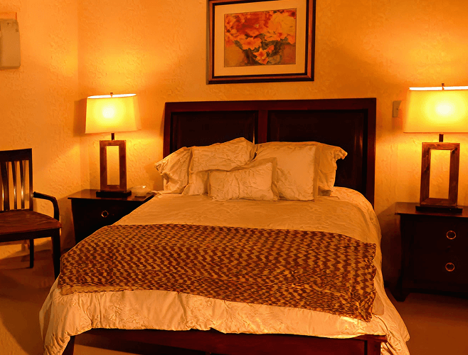 Cozy resident bedroom with warm lighting.