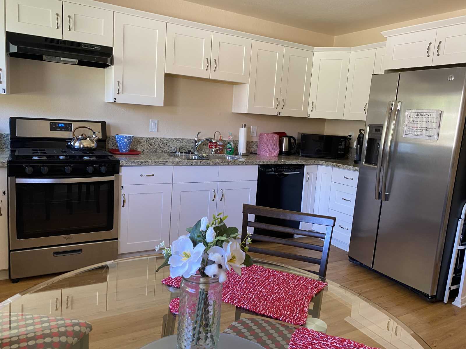 Bright kitchen area with modern appliances.
