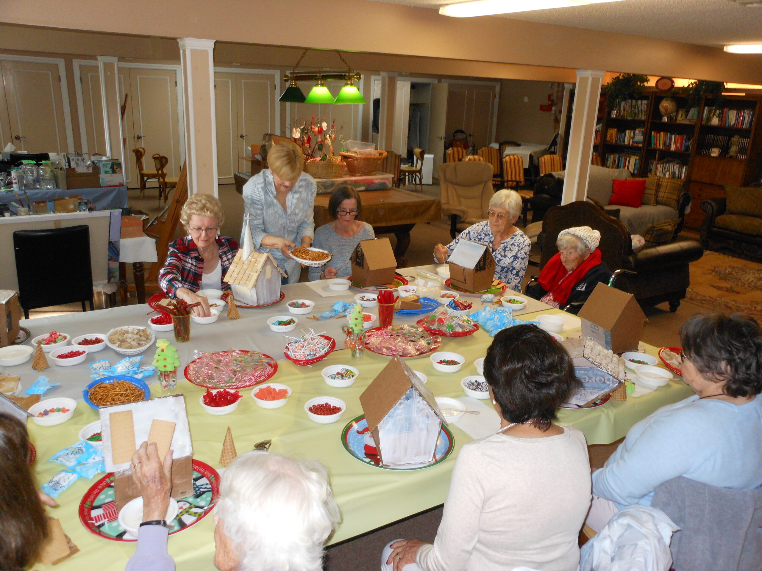 Residents engaged in a crafting activity at the facility.