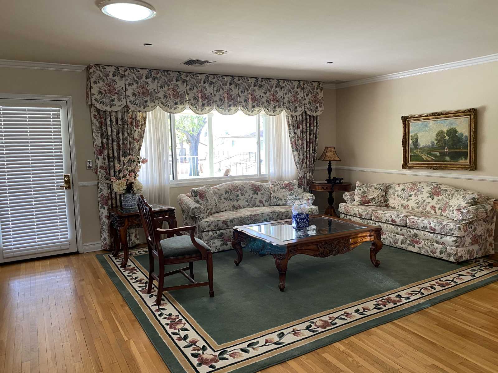 Cozy common area with floral furniture