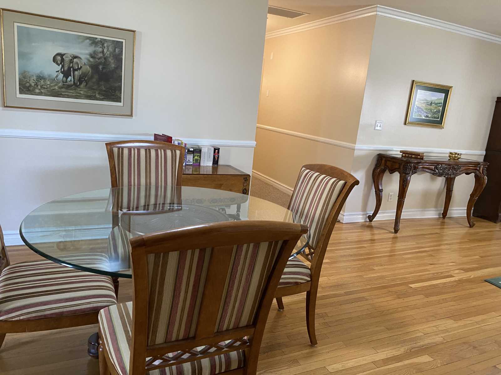 Dining area with a glass table and chairs