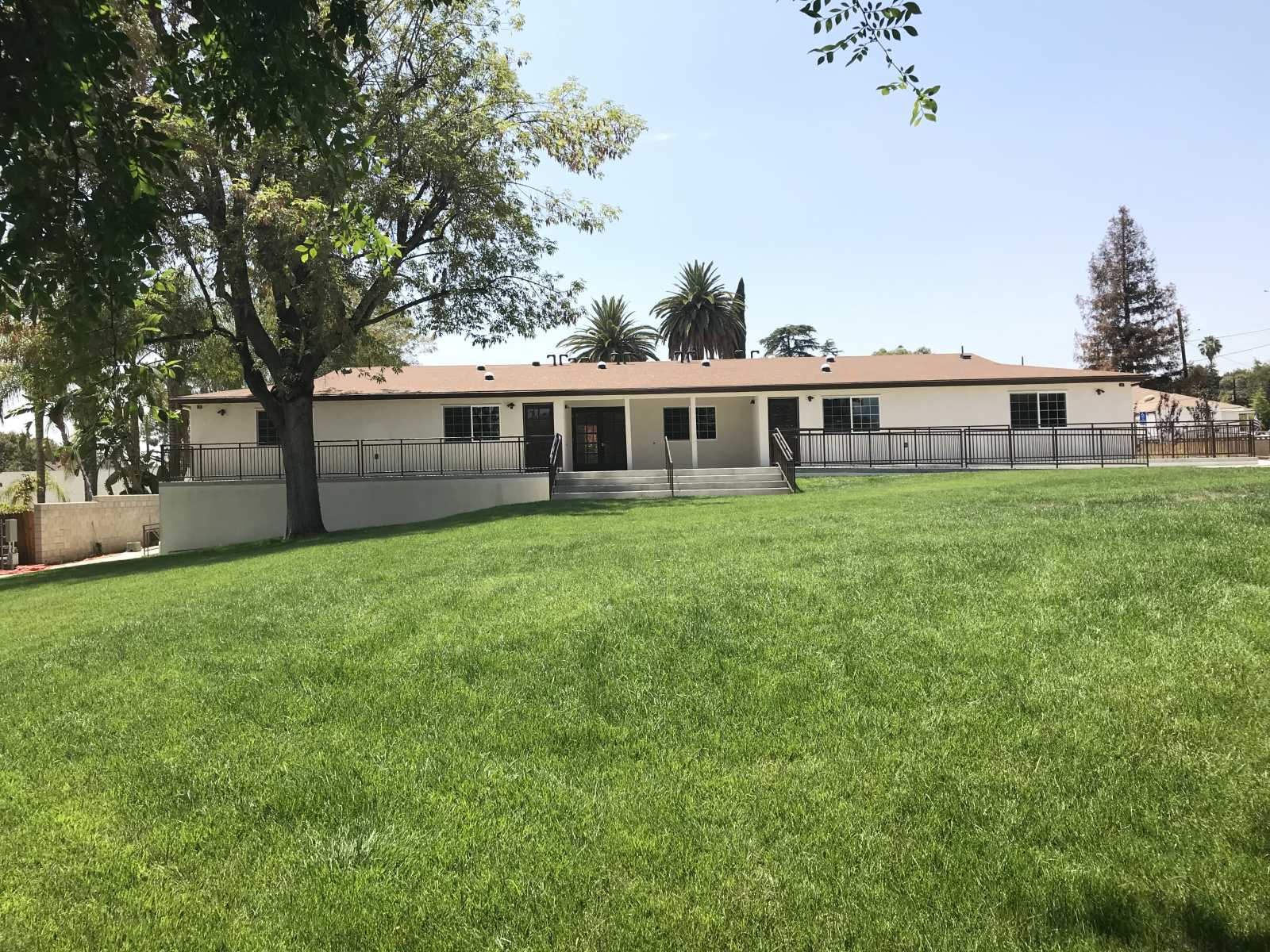 Exterior view of a building surrounded by grass.