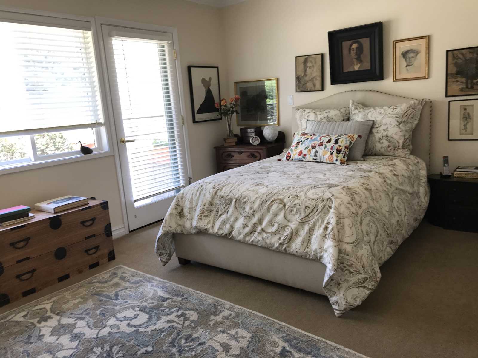 Cozy private resident bedroom with artwork.