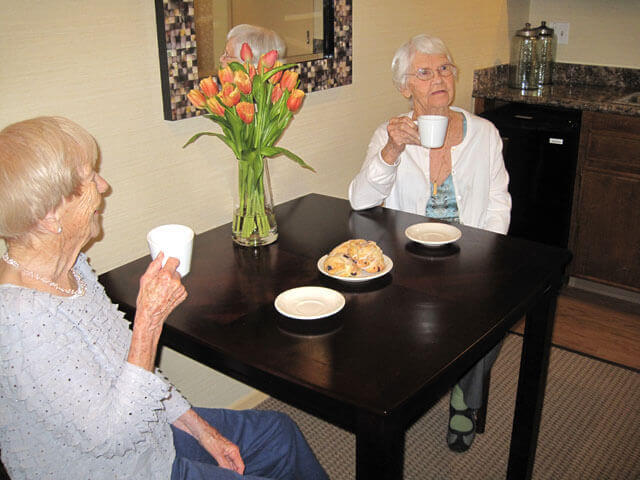 Two residents enjoying a meal together.