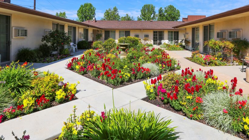 Beautiful garden area with colorful flowers and pathways.