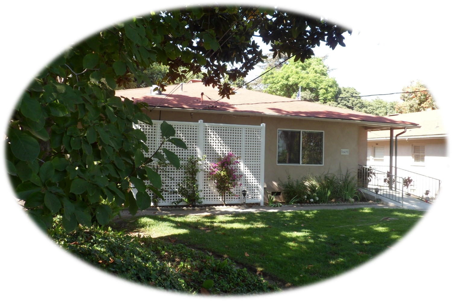 Exterior view of a single-story building with landscaping
