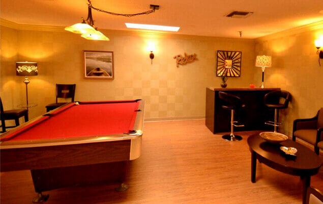 Interior view of a recreational room with a pool table