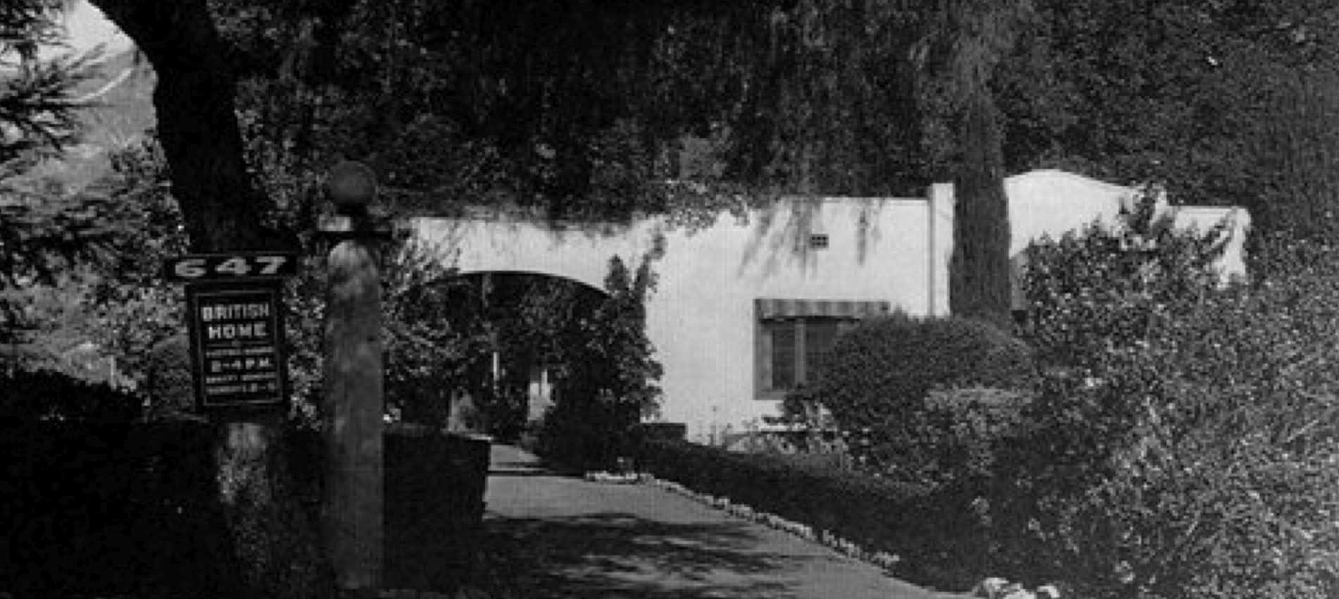 Exterior view of the British Home with pathway and sign