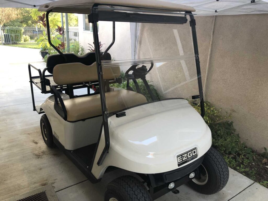 Golf cart parked outside facility