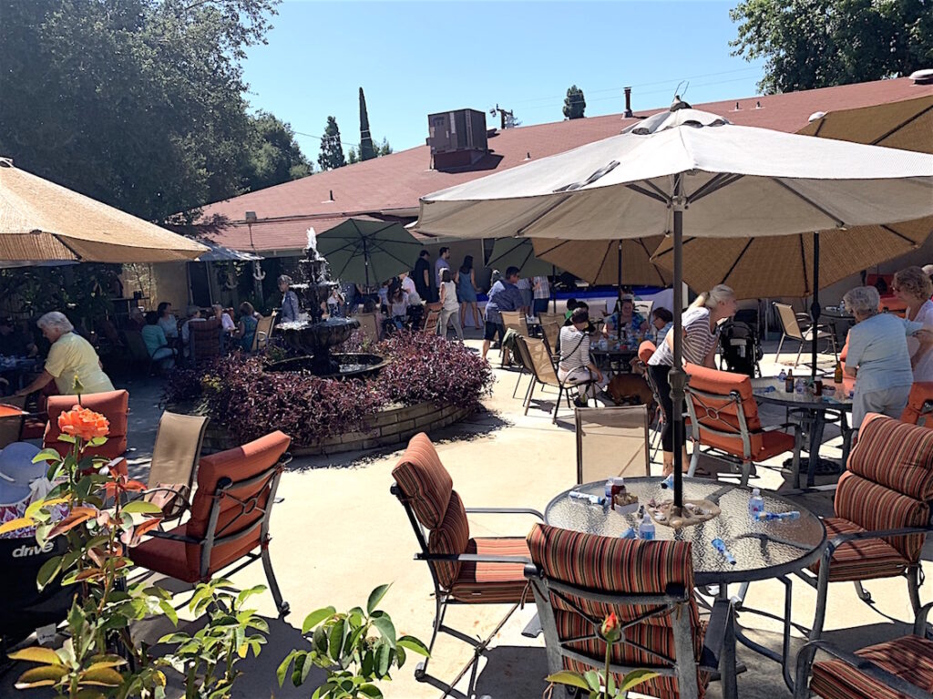 Residents enjoying an outdoor gathering in the courtyard.