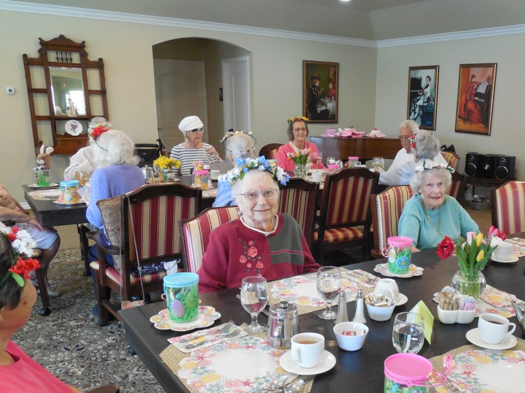 Seniors enjoying a meal in a dining room setting.