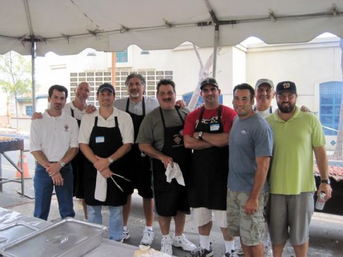 Group of chefs at an outdoor cooking event.