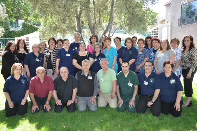 Group photo of staff in an outdoor setting.