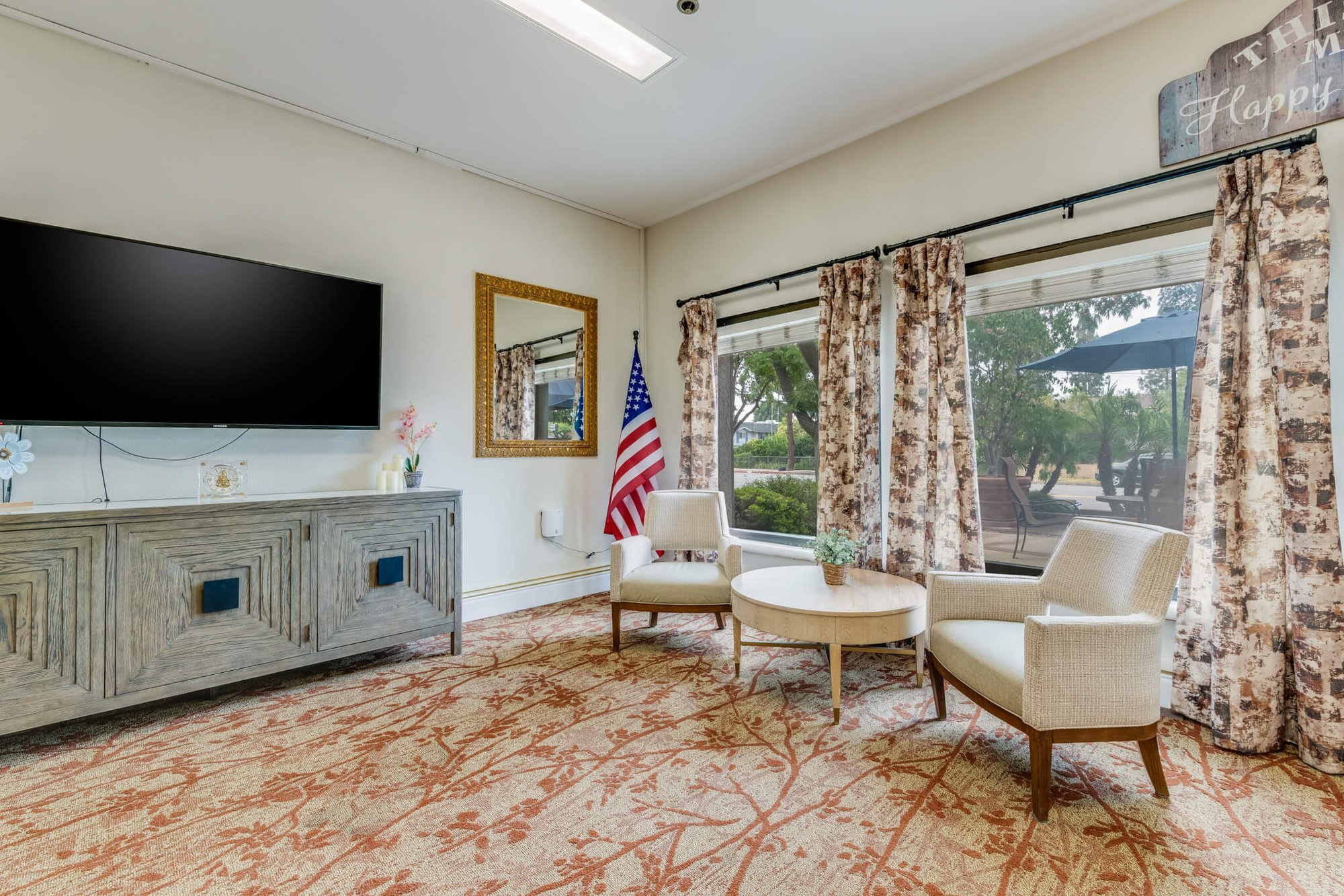 Common area with seating and television.