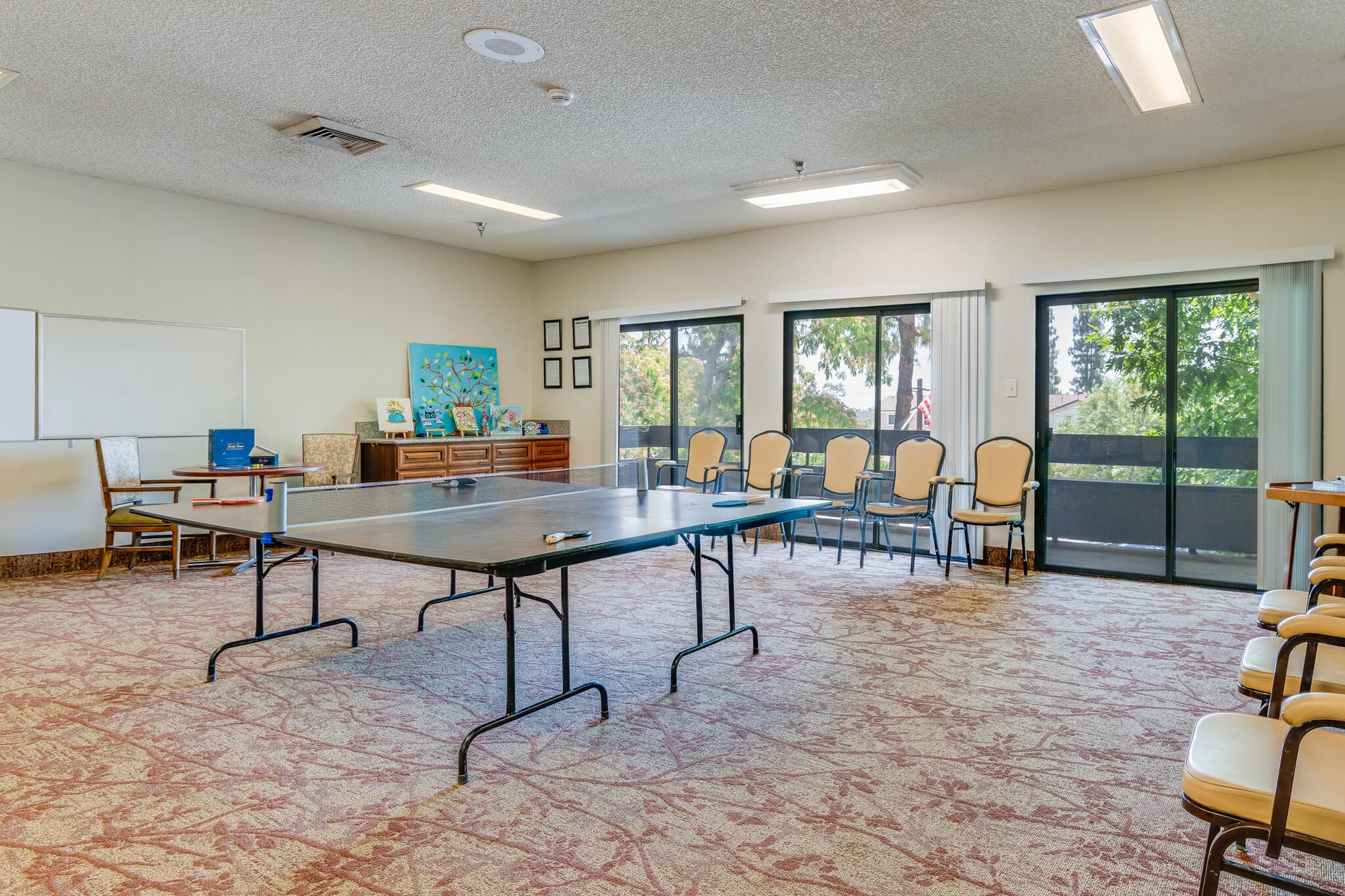 Interior view of a common area with tables and chairs