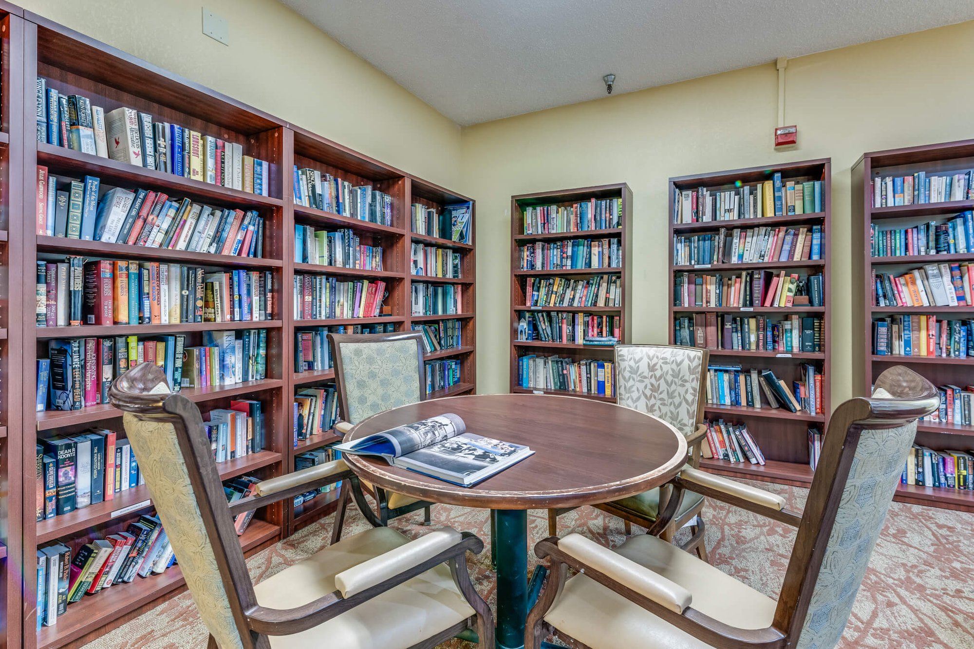 Cozy reading area with bookshelves and seating