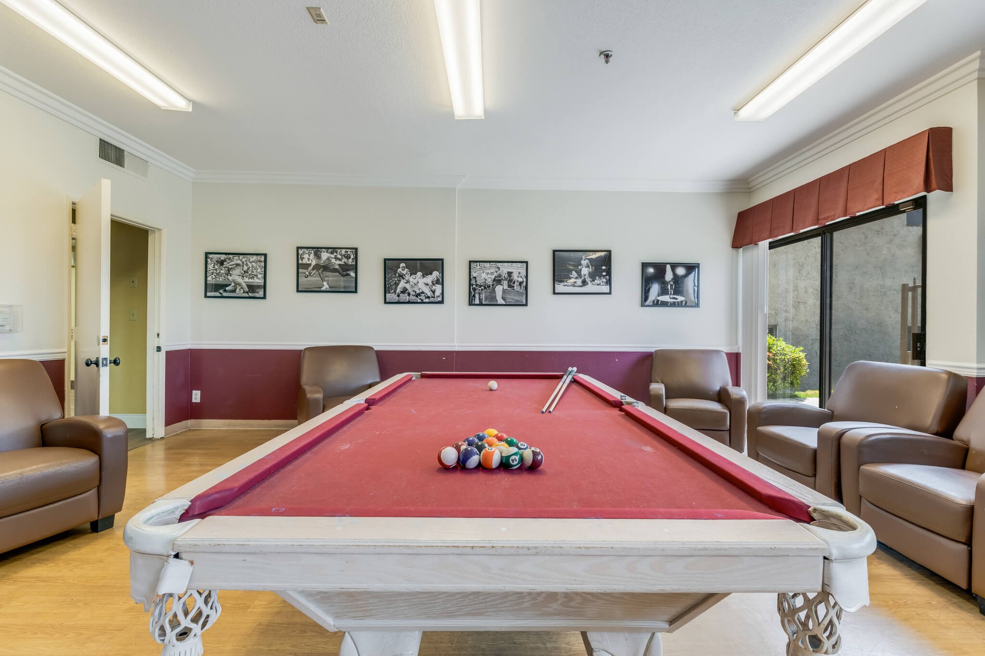 Interior view of a common area with a pool table.