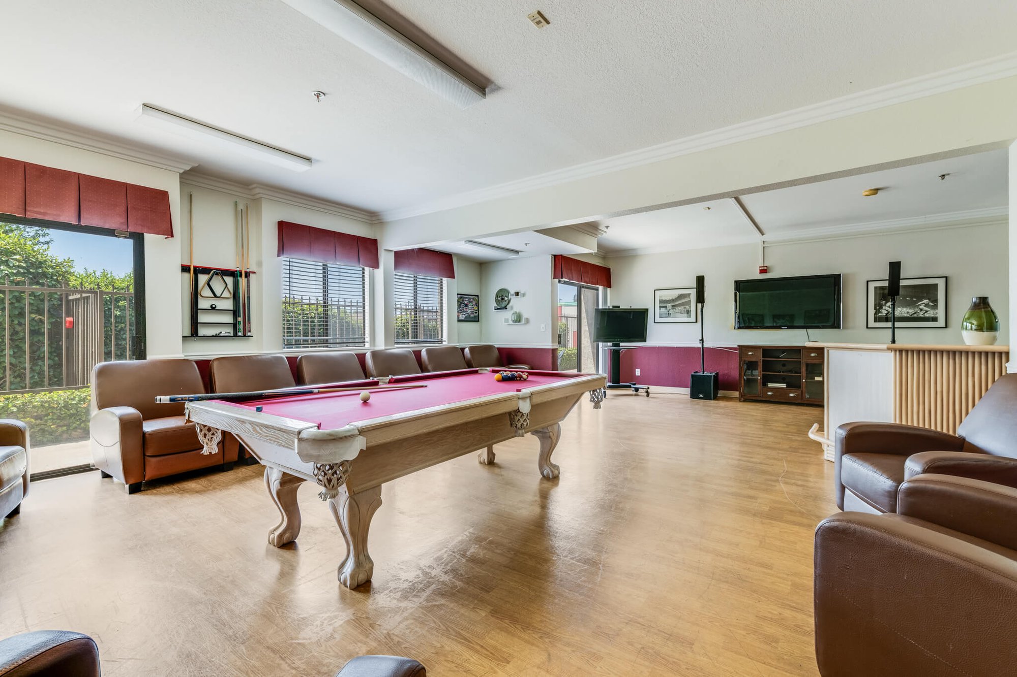 Common area with a pool table and seating