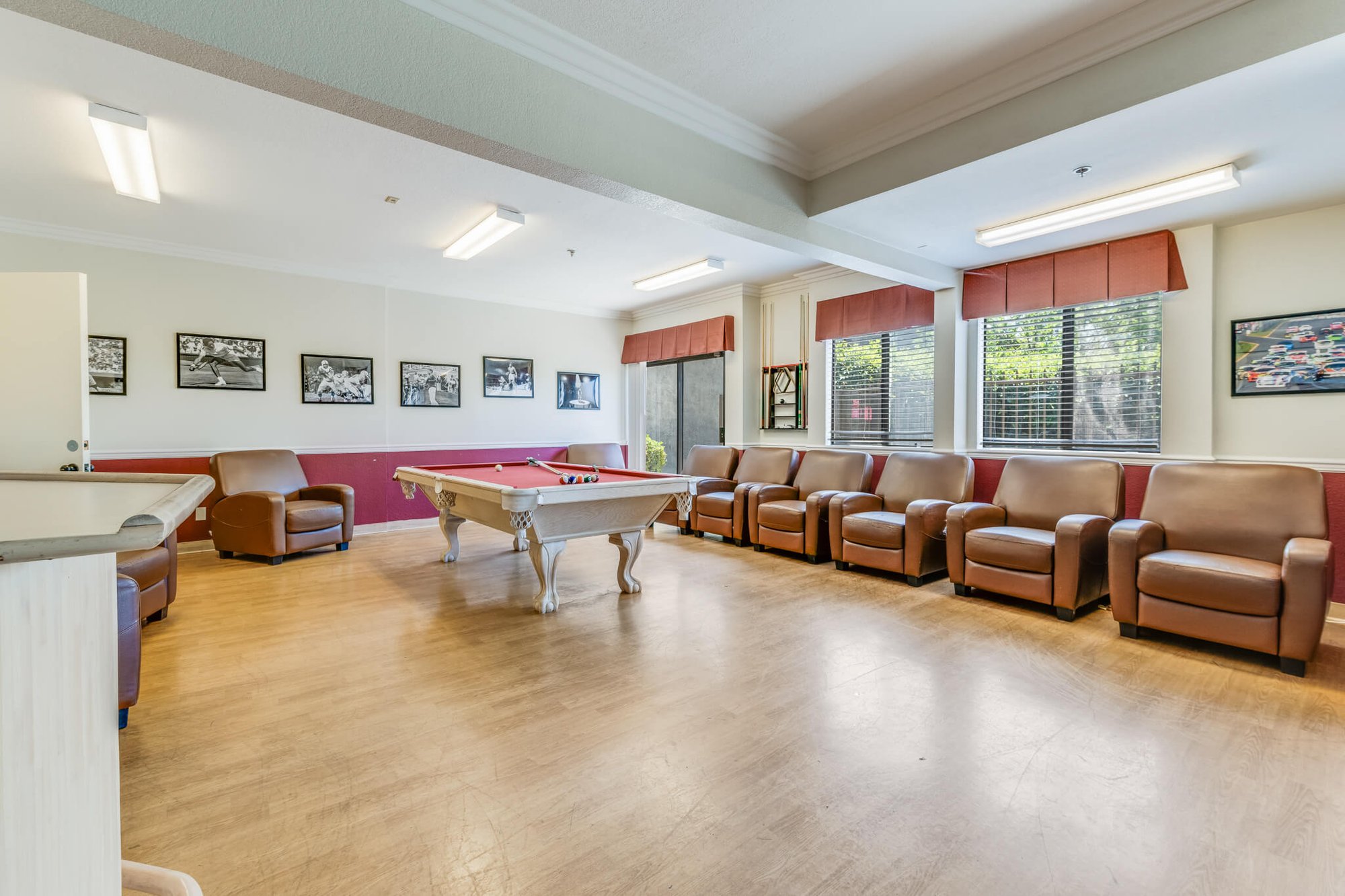 Interior common area with seating and billiards table.